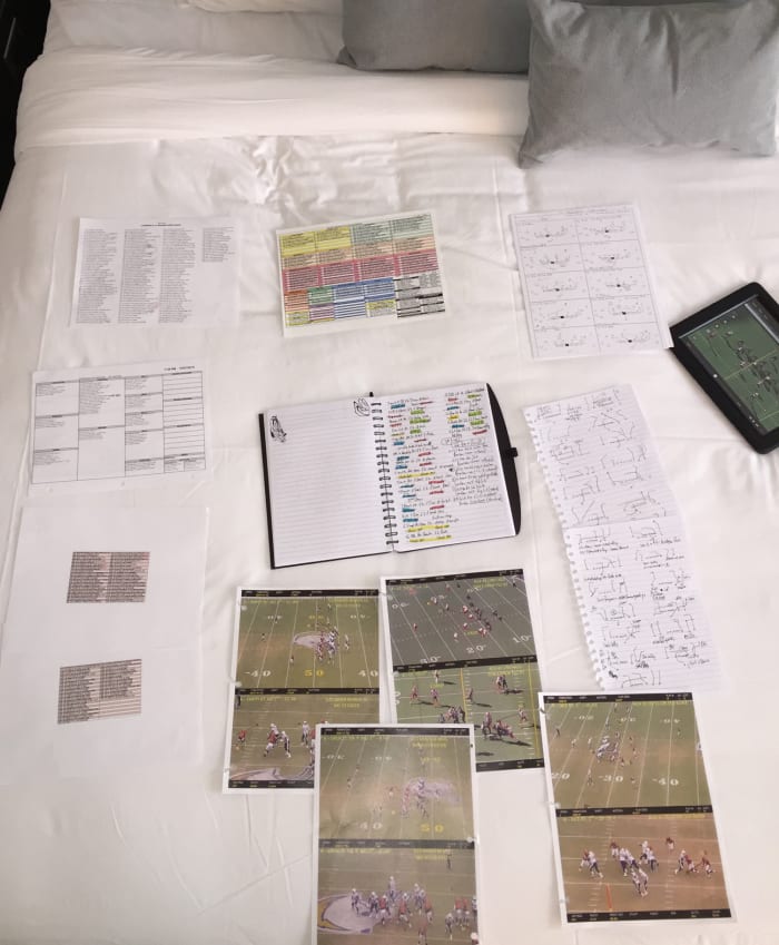 The day before the Browns game, Palmer has his study materials all set up in his Cleveland-area hotel room.
